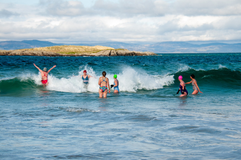 Two people relaxing in the sea on Islay
