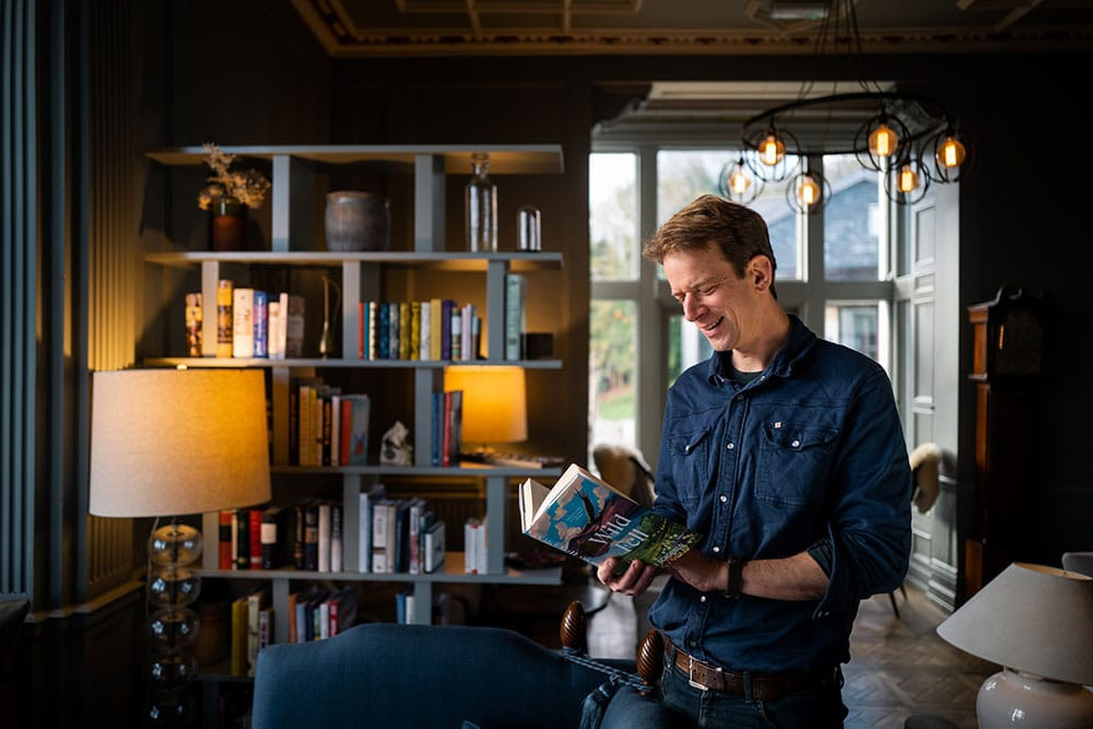 Image of man reading a book