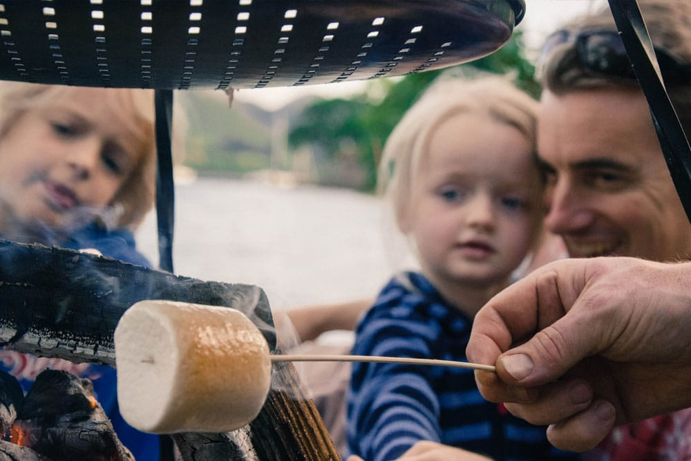 toasting marshmallows at the forest school