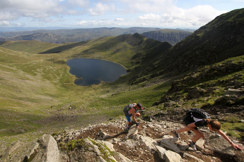 Triathlon competitors above red tarn