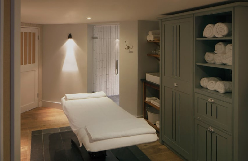 A bed in a treatment room in Swim Club