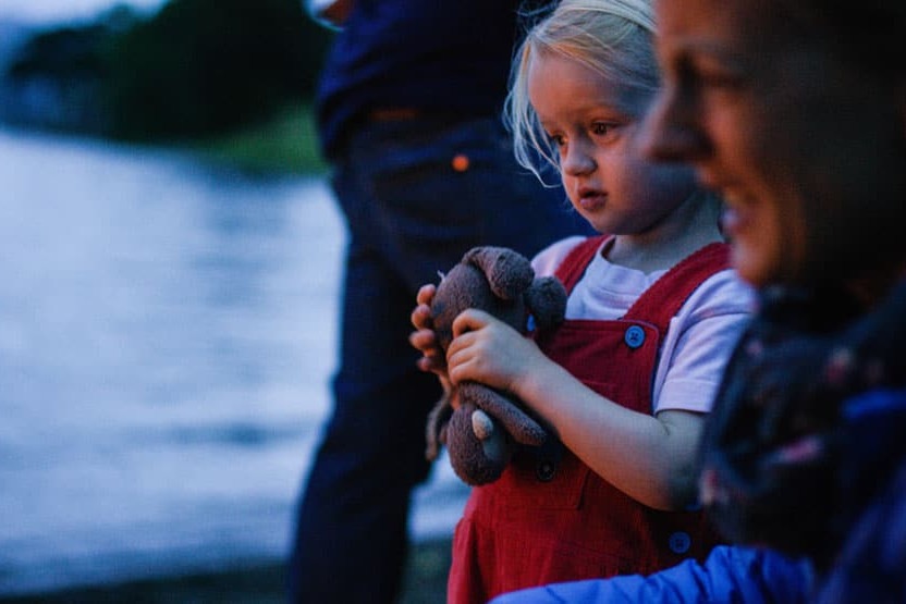 Fire by the lake with family