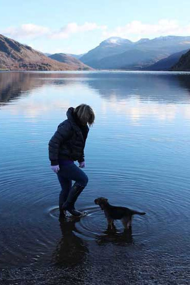 Riley and his owner in the lake