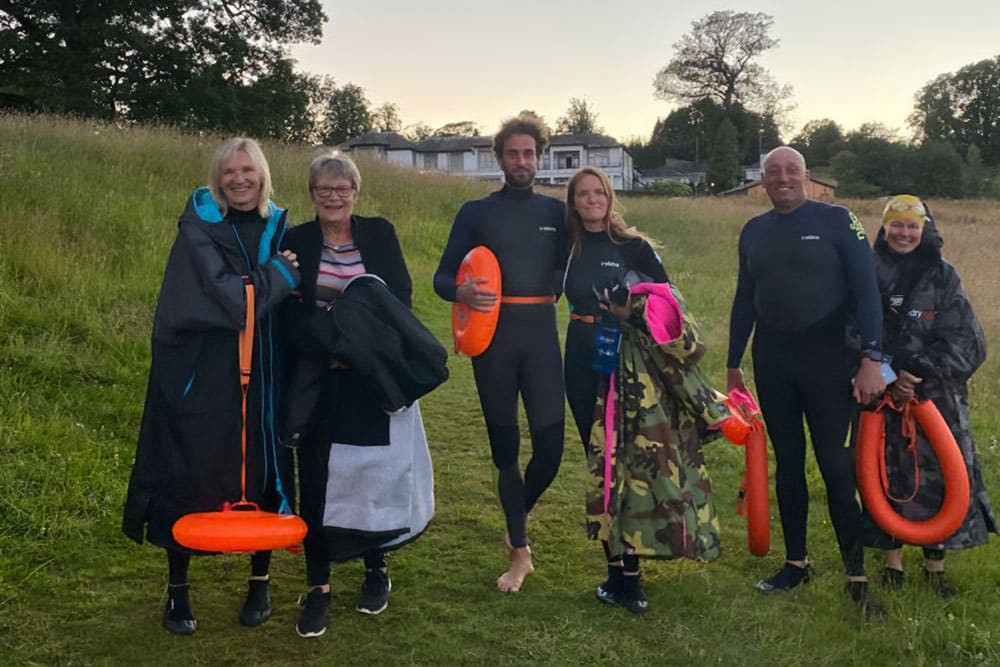Jo Whiley open water swimming in Ullswater with family