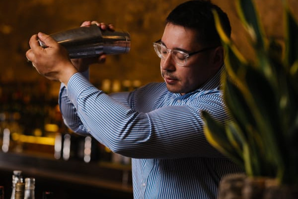 Bartender shaking cocktail mix