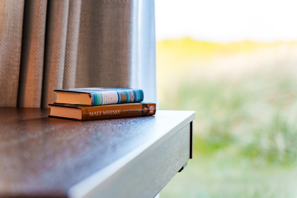 Books in one of the rooms at Another Place, The Machrie