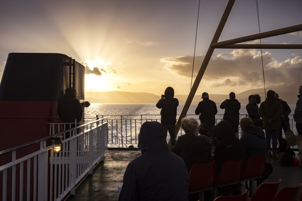 People on the ferry to Islay at sunset